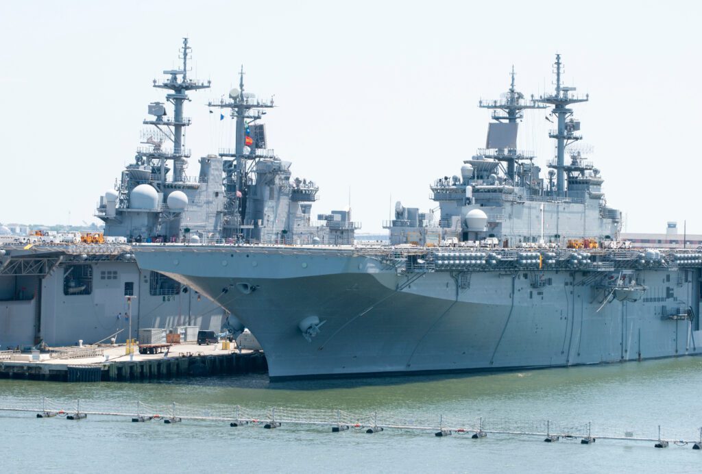 A U.S. Navy Ship docked inland.